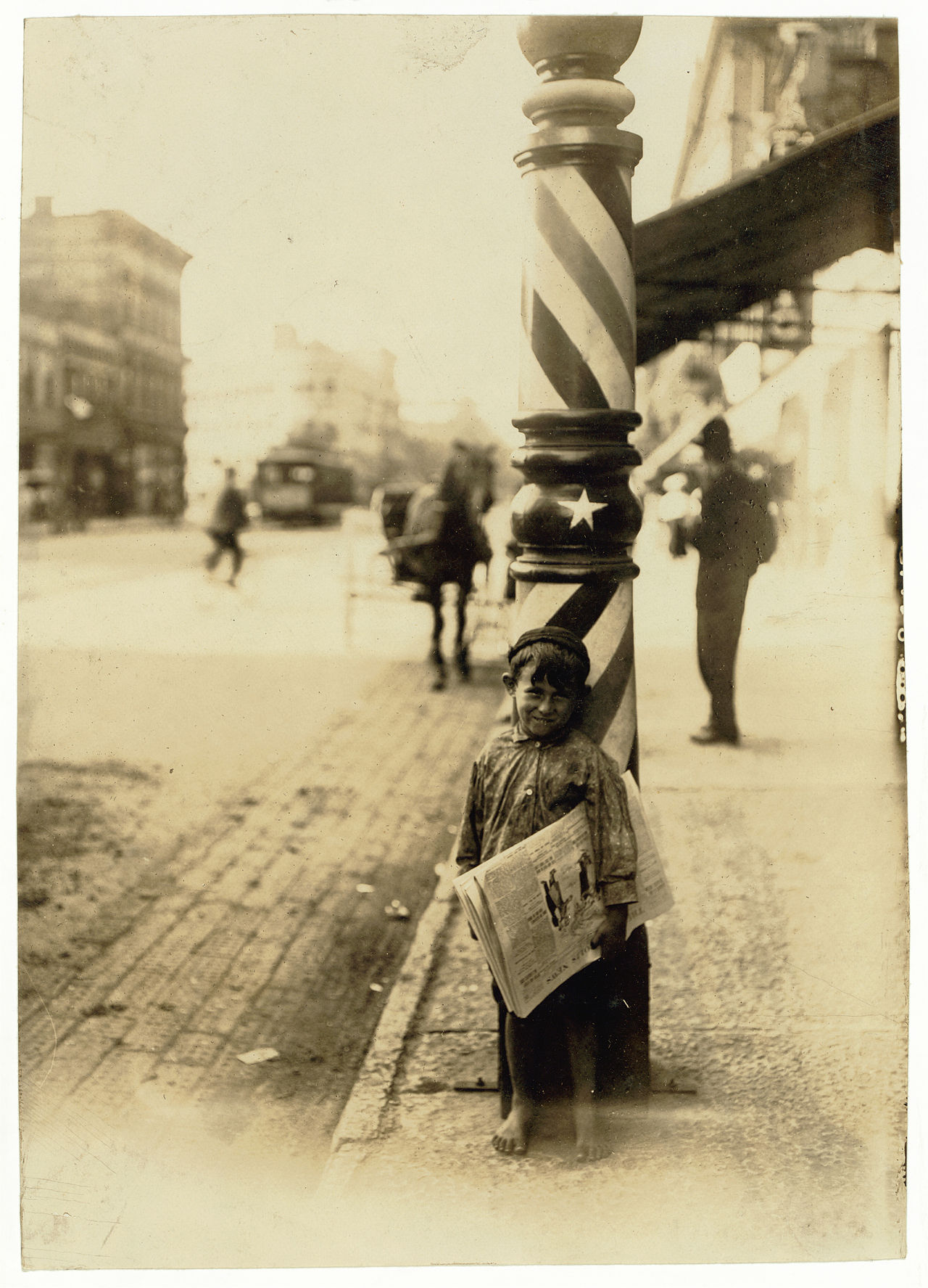 A newsboy running down a street at dawn, fresh papers bundled under his arm, city waking behind him.